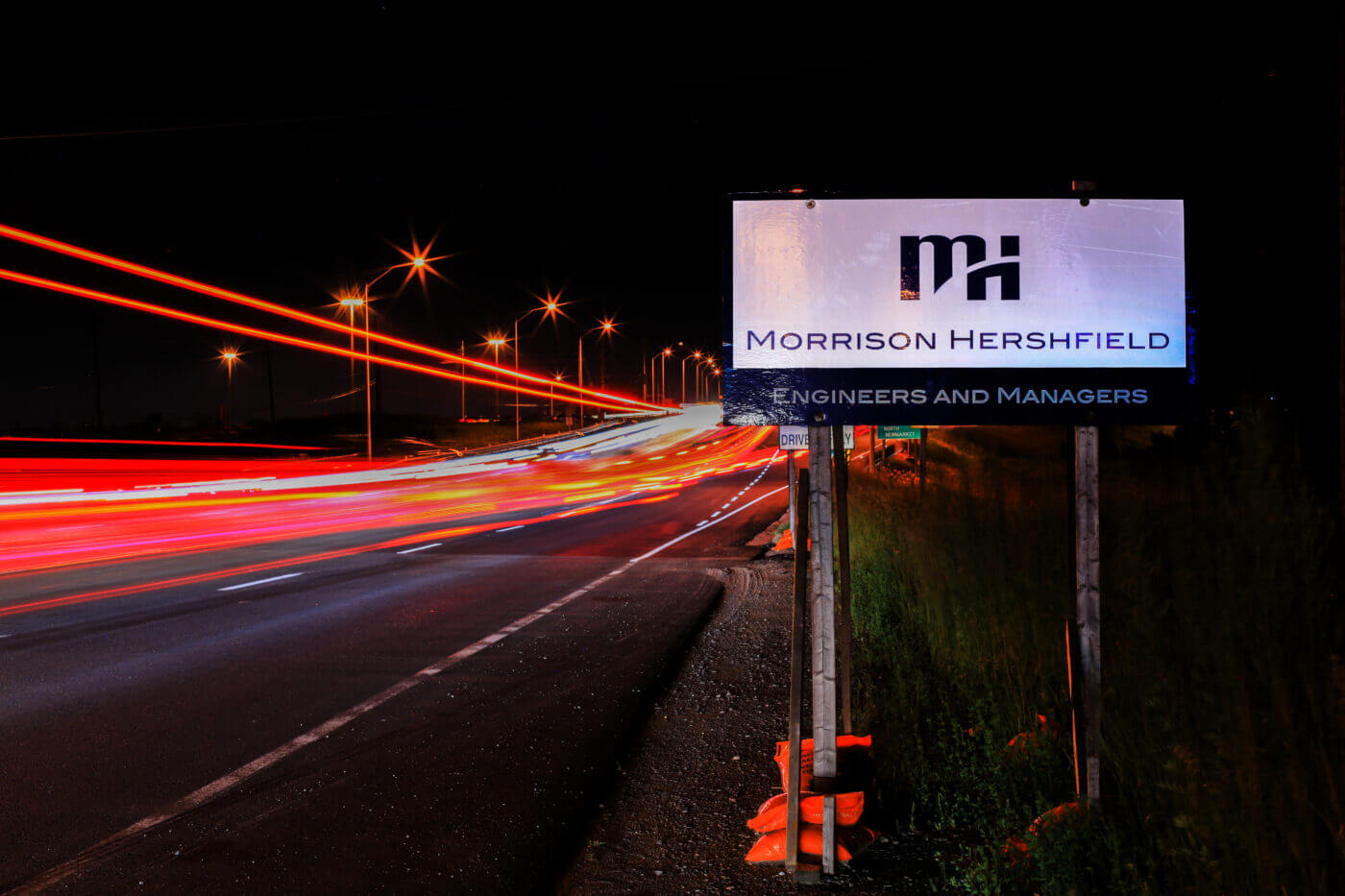 MH Signage at Night Before Interchange
