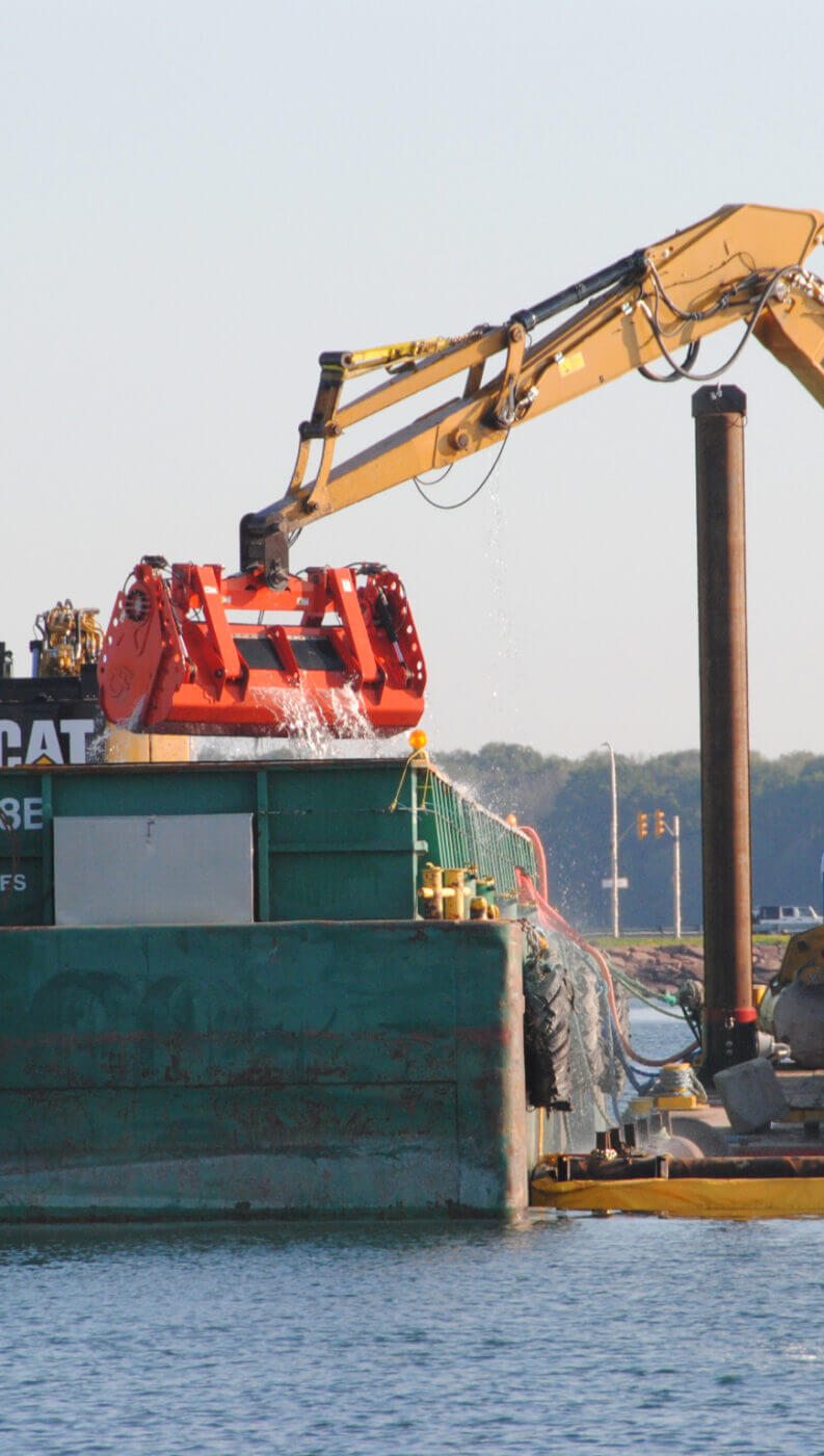 waste management - crane unloading waste into large bin